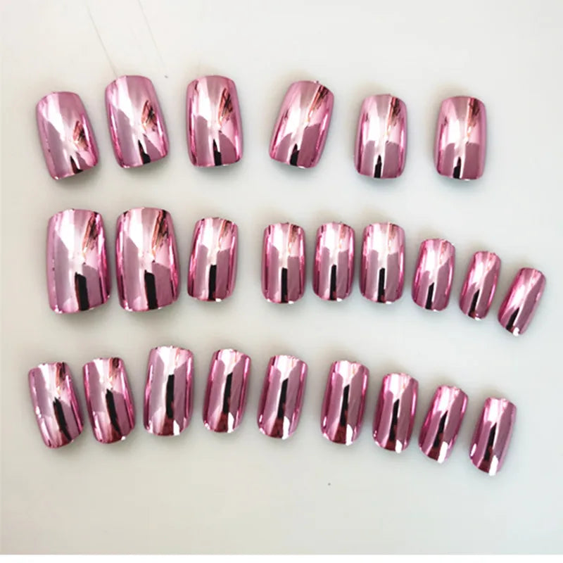 Pink chrome press-on nails arranged in rows