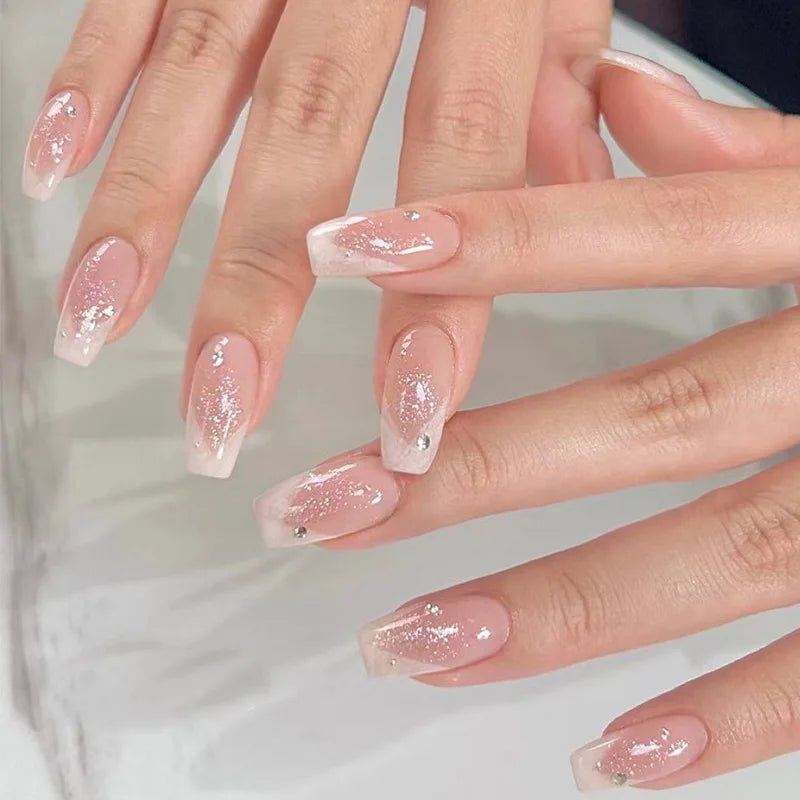 Decorated nail designs shown on hands