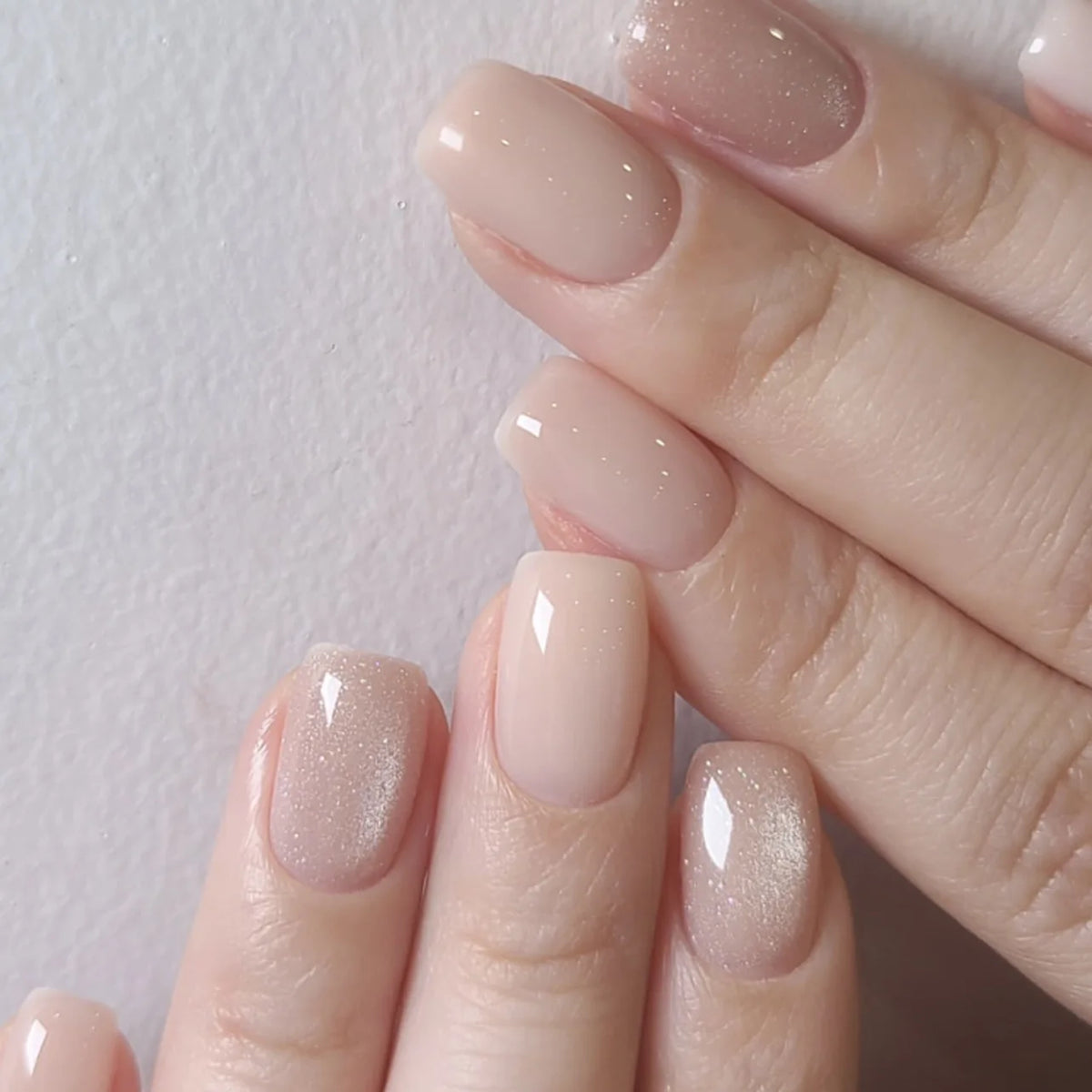 Decorated nail designs shown on hands