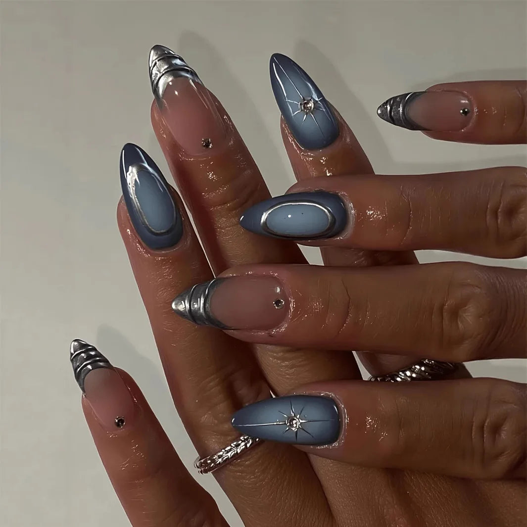 Metallic and embellished nails shown on hands