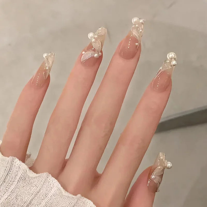 Decorated nail designs shown on hands