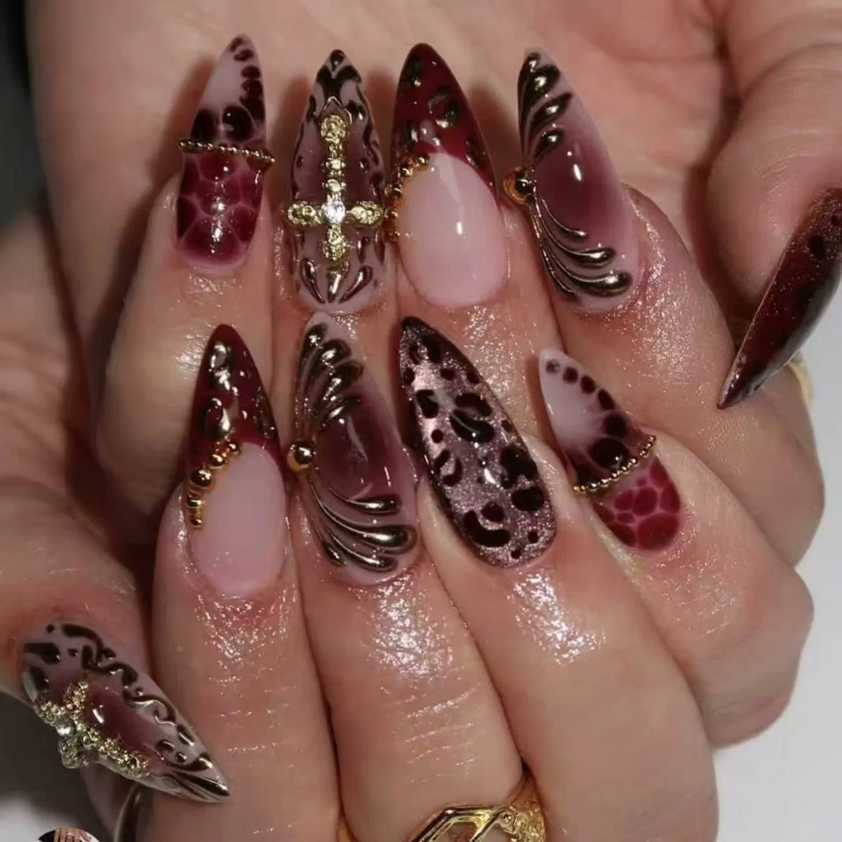 Long decorated nails shown on hands