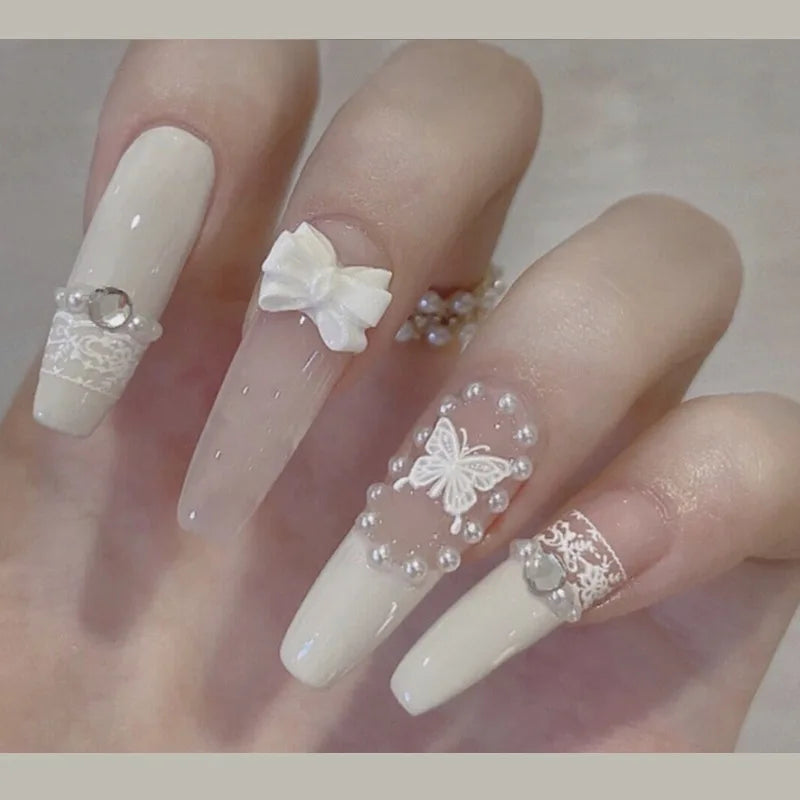 Decorated nail designs shown on hands