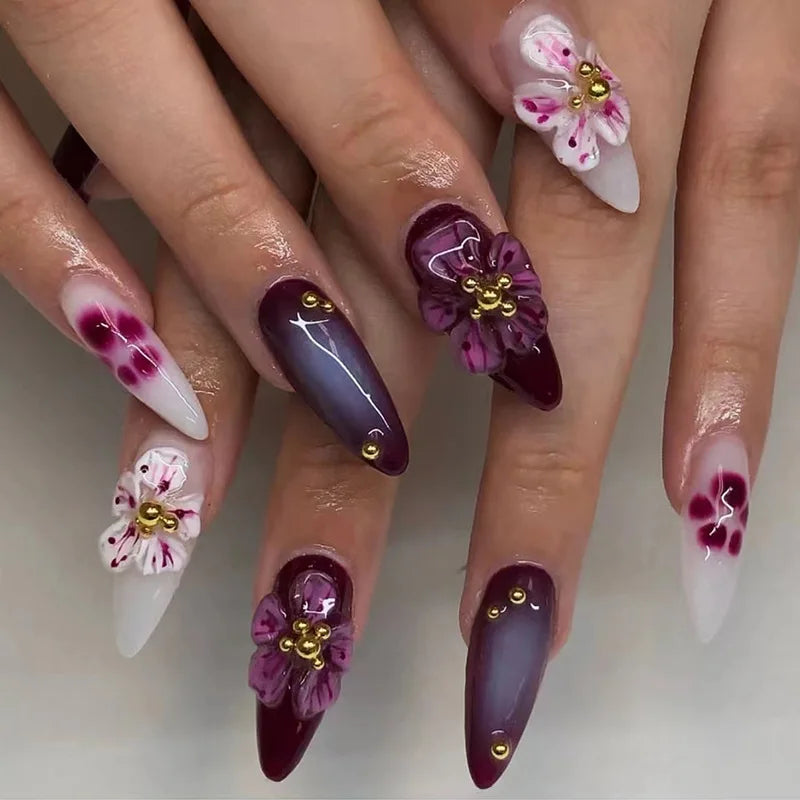 Decorated nail designs shown on hands