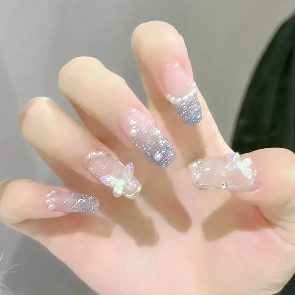Decorated translucent nails shown on hands