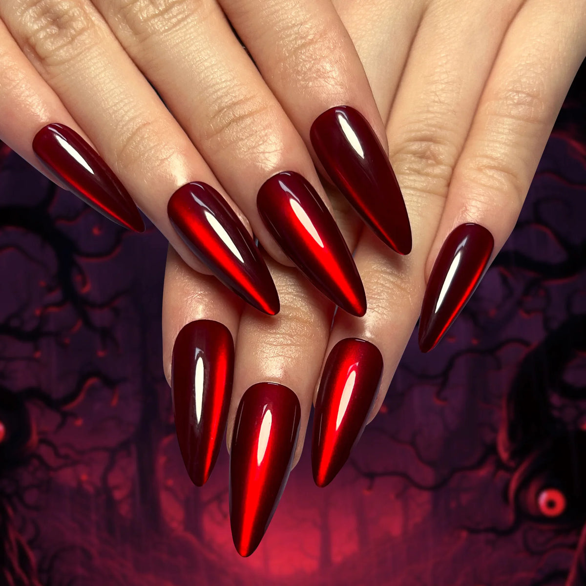 Long pointed decorative nails shown on hands