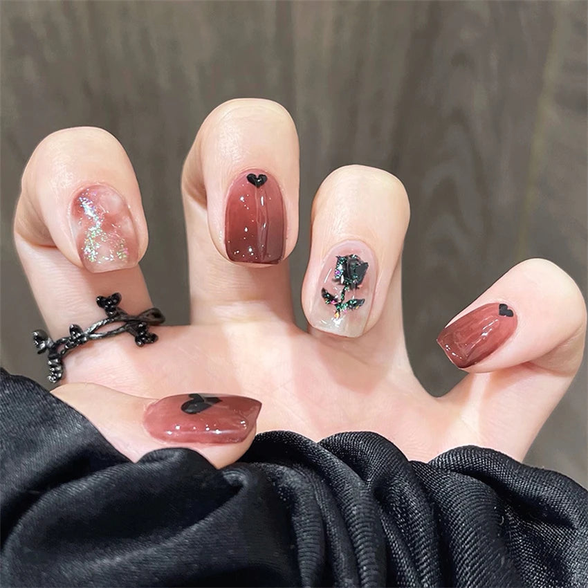 Decorated nail designs shown on hands