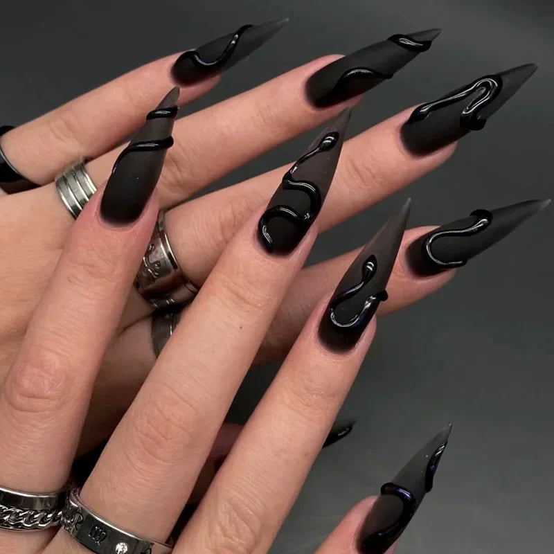Long decorated nails shown on hands