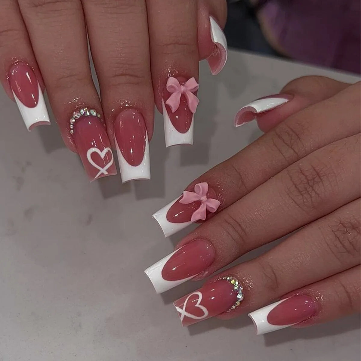 Decorative nail designs shown on hands
