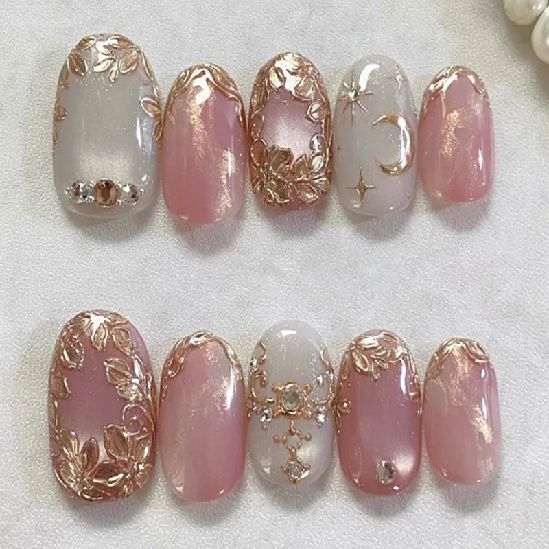 Pink decorative press-on nails arranged in rows
