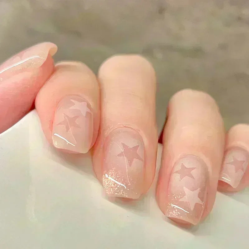 Decorated nail designs shown on hands