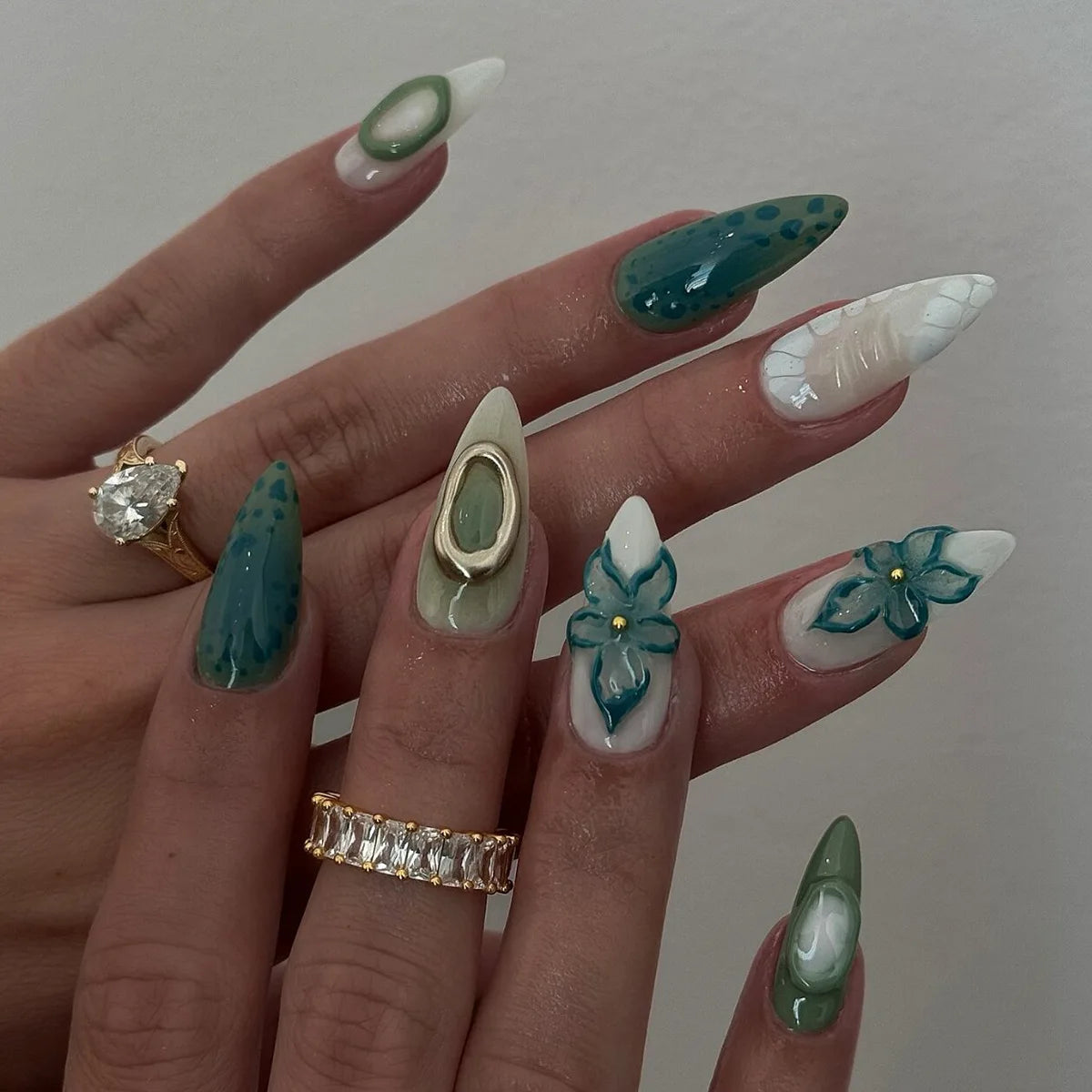 Decorated nail designs shown on hands