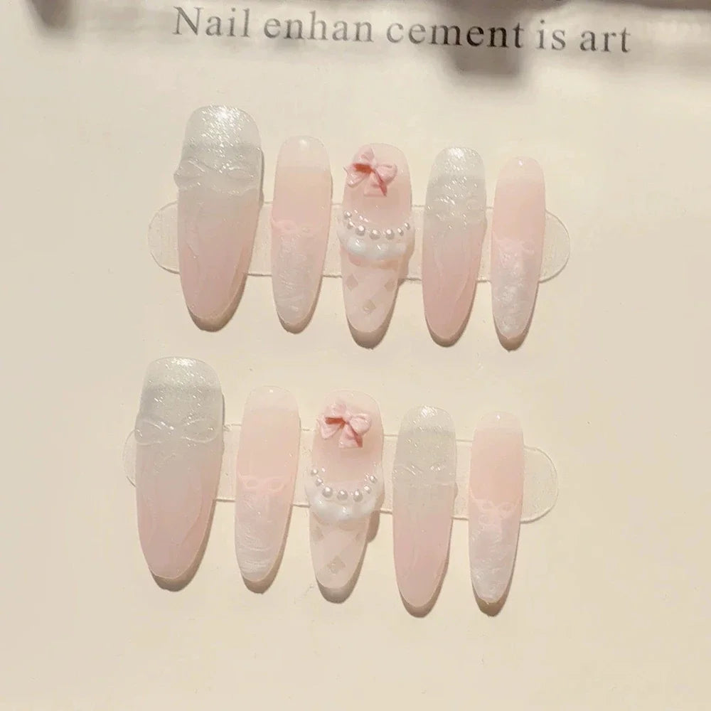 Decorated press-on nail sets with raised embellishments on display cards