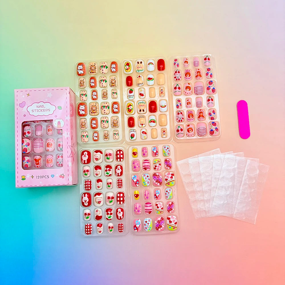 Assorted colorful press-on nails with packaging and manicure accessories