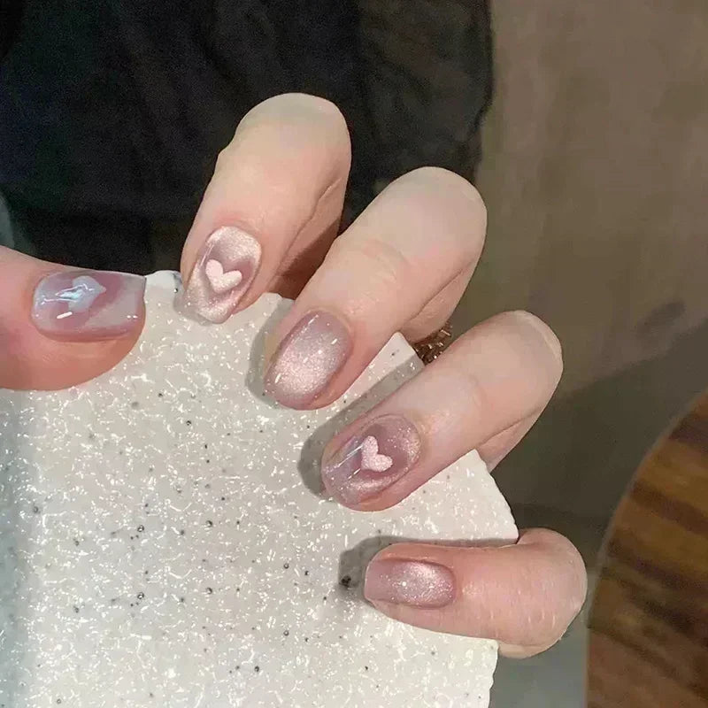 Decorated nail designs shown on hands