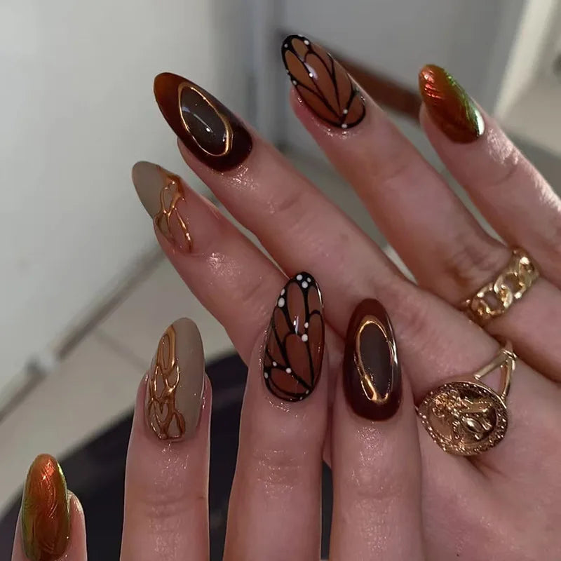 Metallic and decorated nail designs shown on hands
