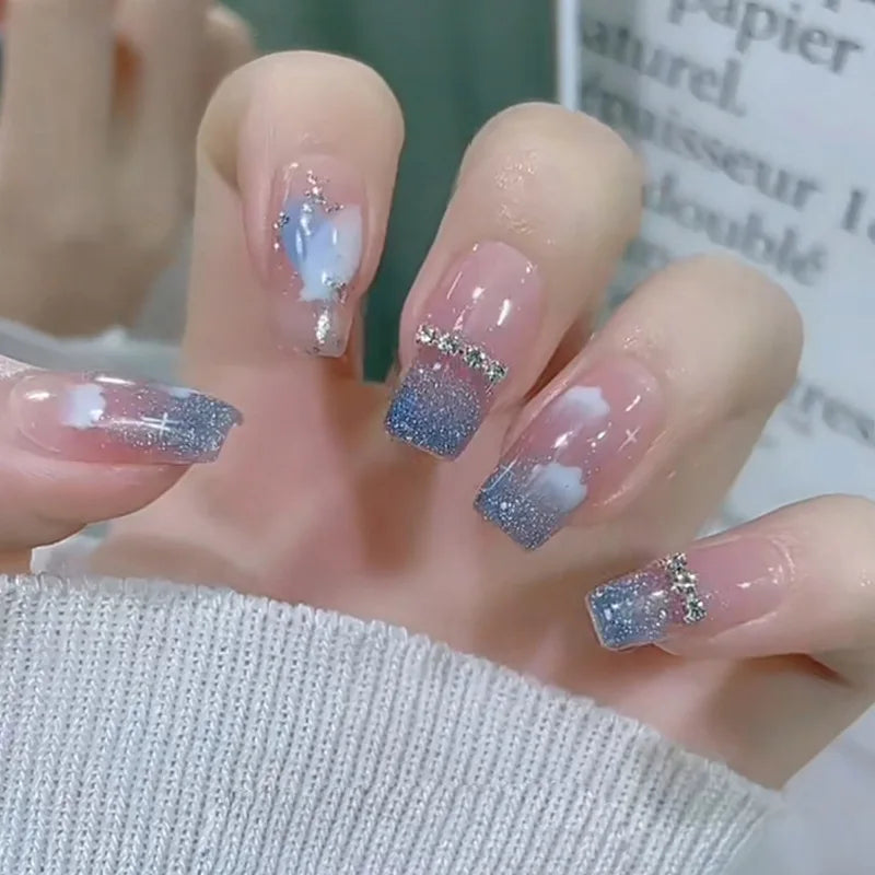 Decorated nail designs shown on hands