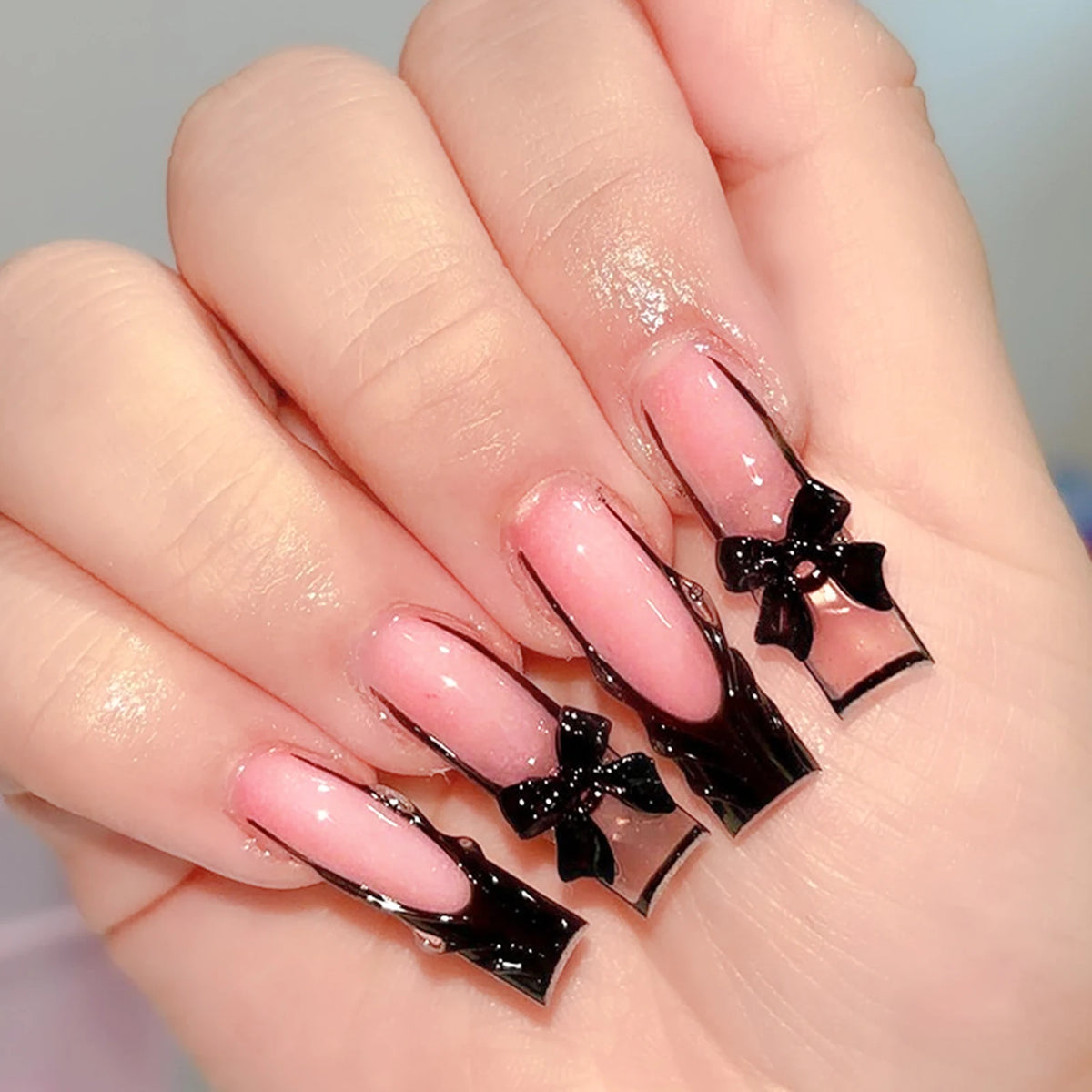 Decorated nail designs shown on hands