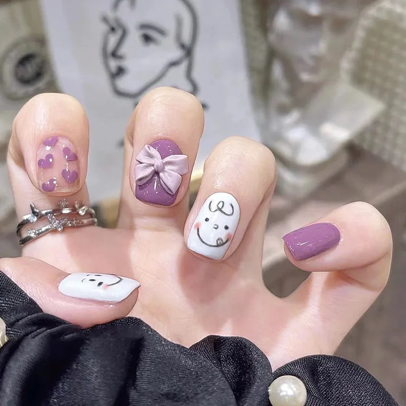 Decorated nail designs shown on hands