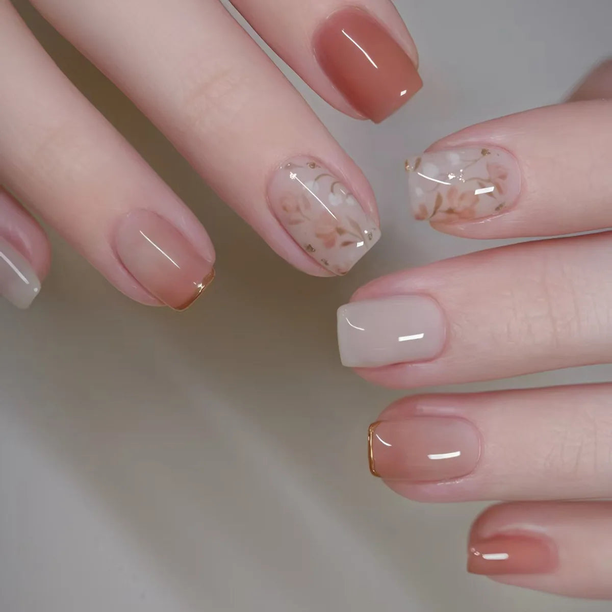 Decorated nail designs shown on hands