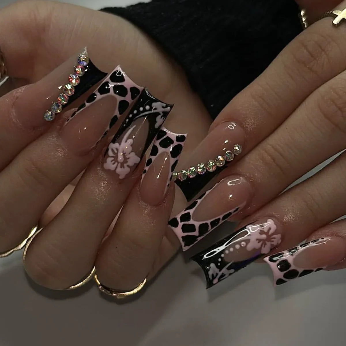 Decorated nail designs shown on hands