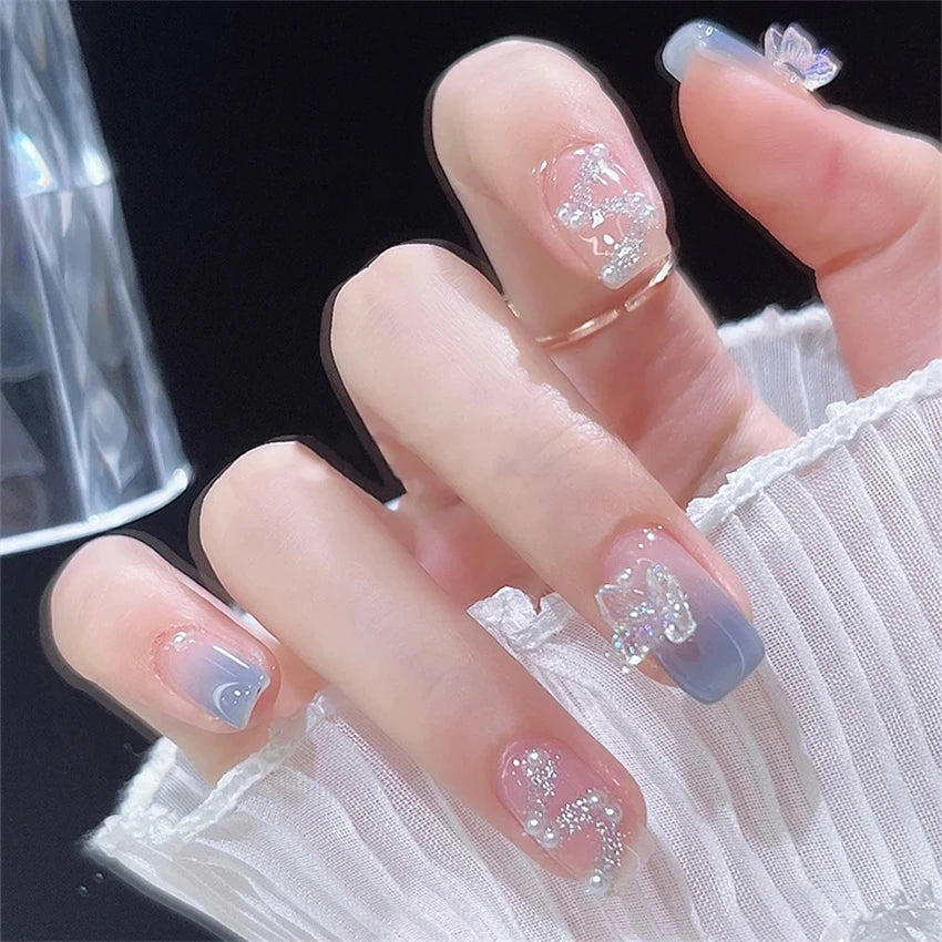 Decorated nail designs shown on hands