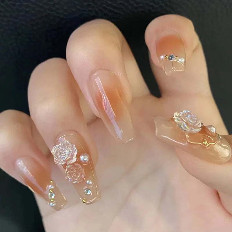Decorated press-on nail designs shown on hands