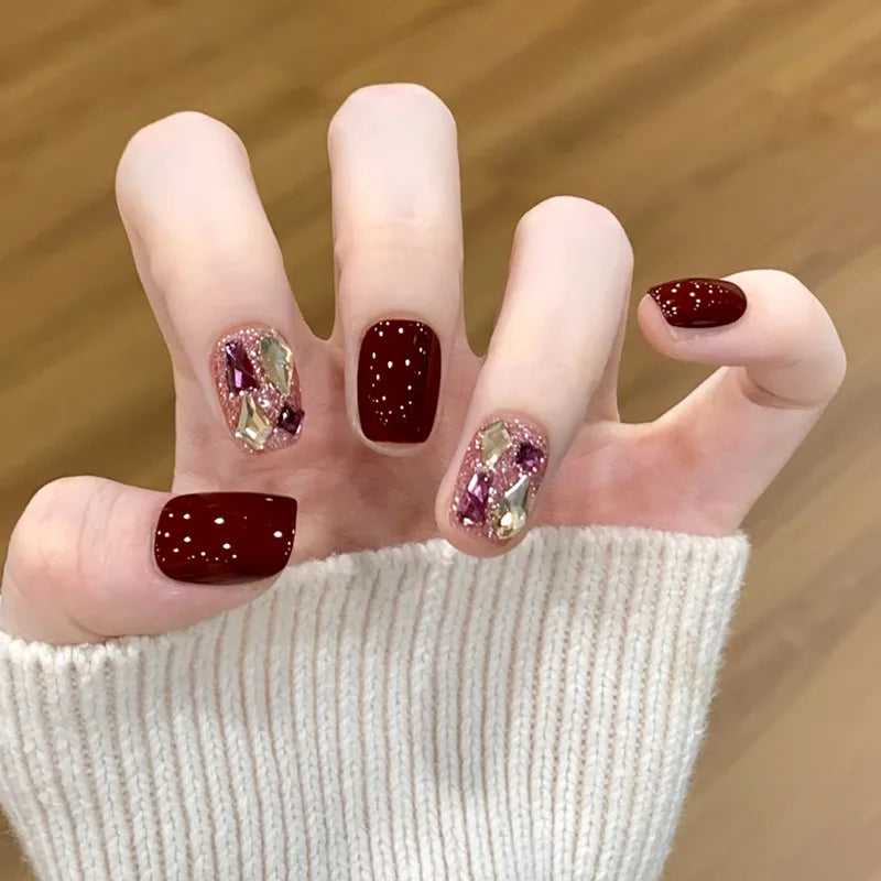 Decorated nail designs shown on hands