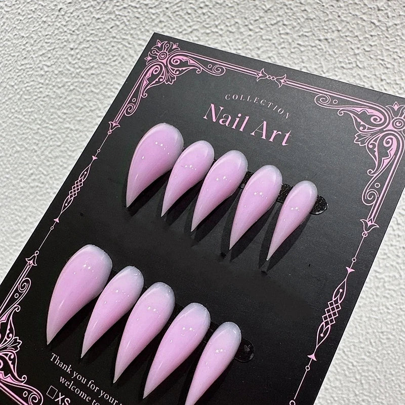 Decorated pointed press-on nails arranged in two rows