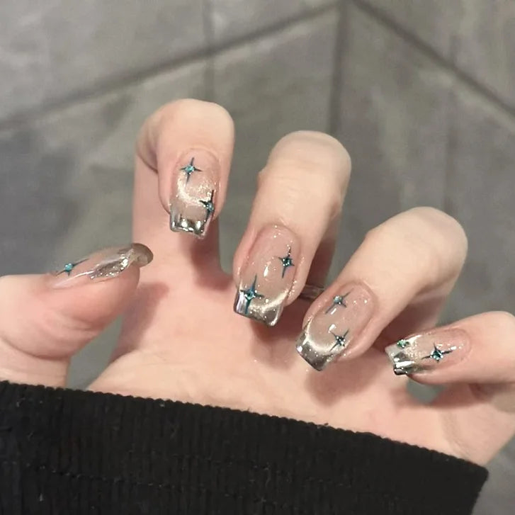 Decorated nail designs shown on hands