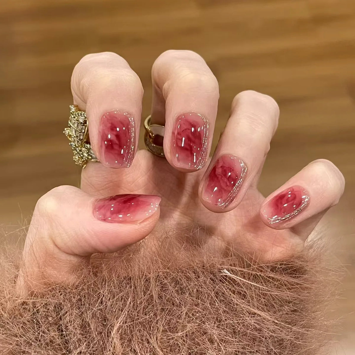 Decorated nail designs shown on hands