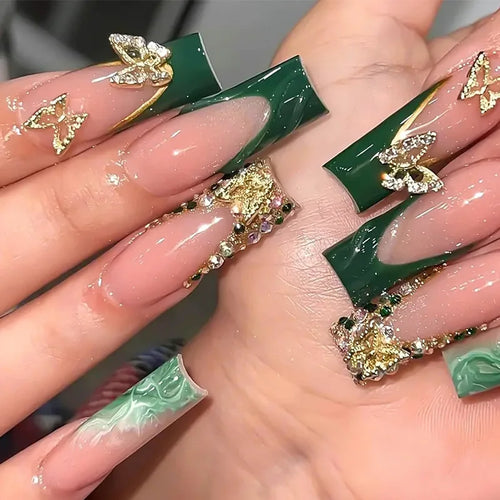 Decorated nail designs shown on hands