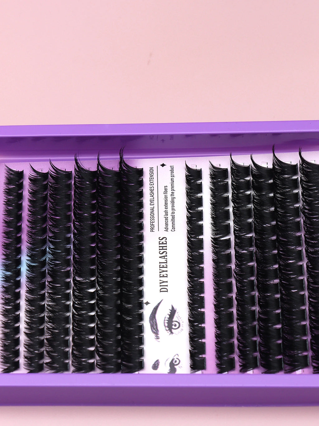 False eyelash clusters arranged in rows in a tray