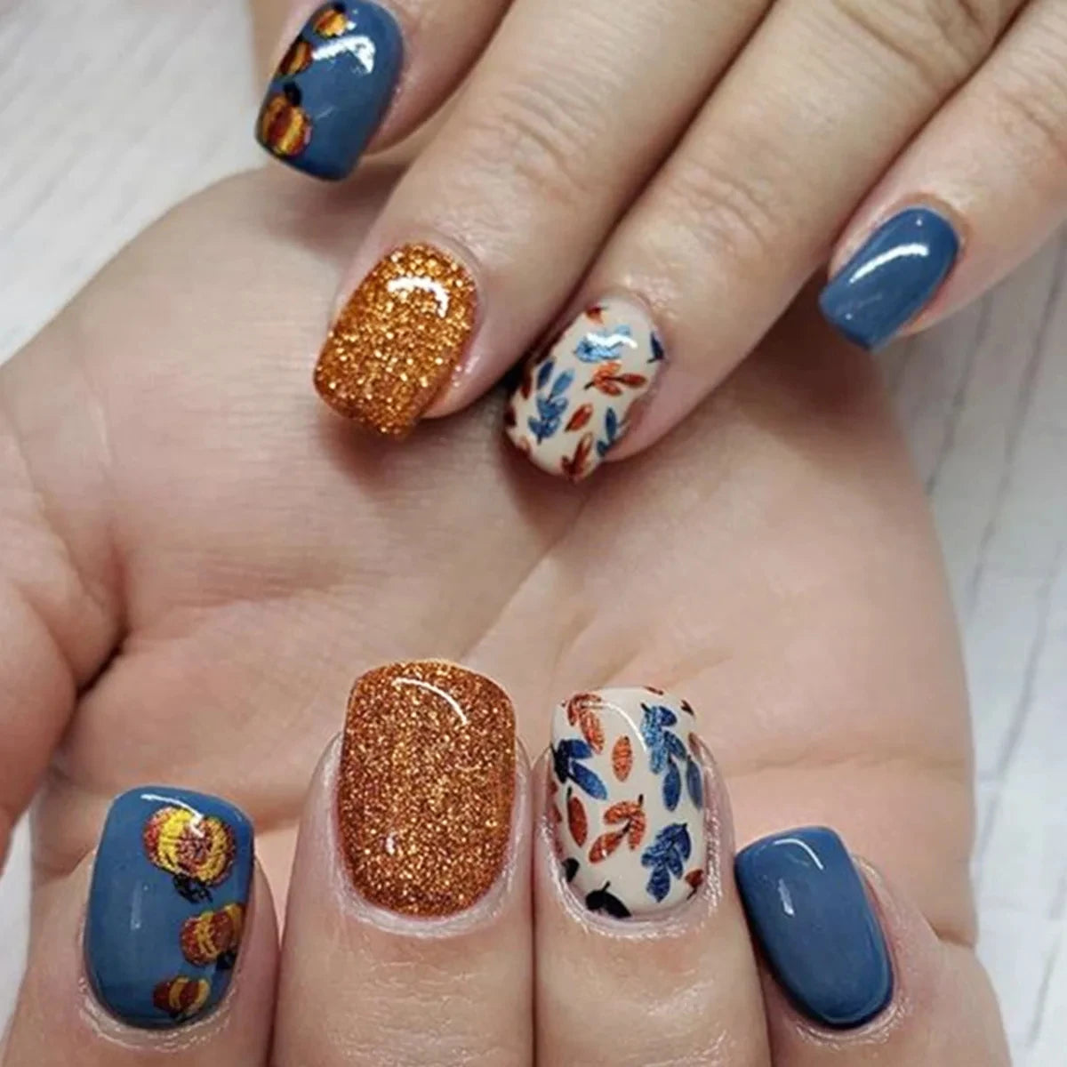 Decorative nail designs shown on hands