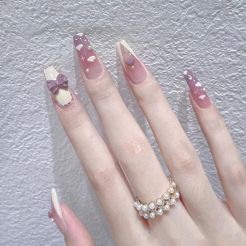 Decorated nail designs shown on hands