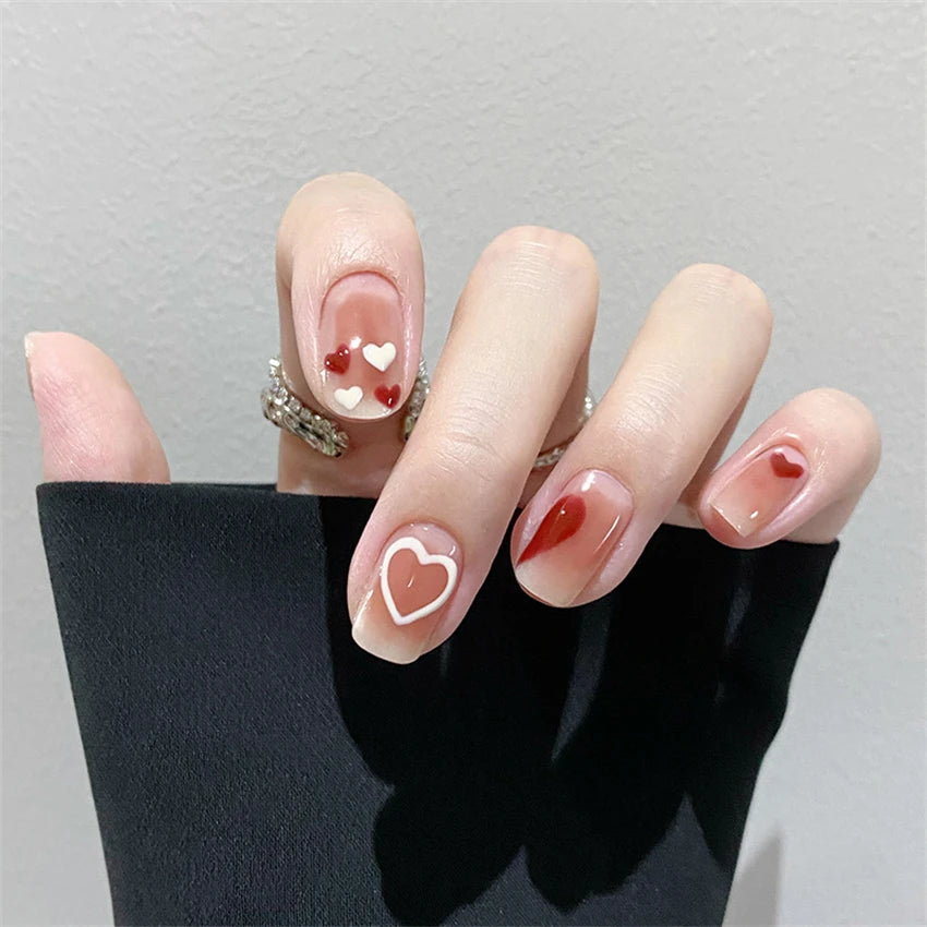 Decorated nail designs shown on hands