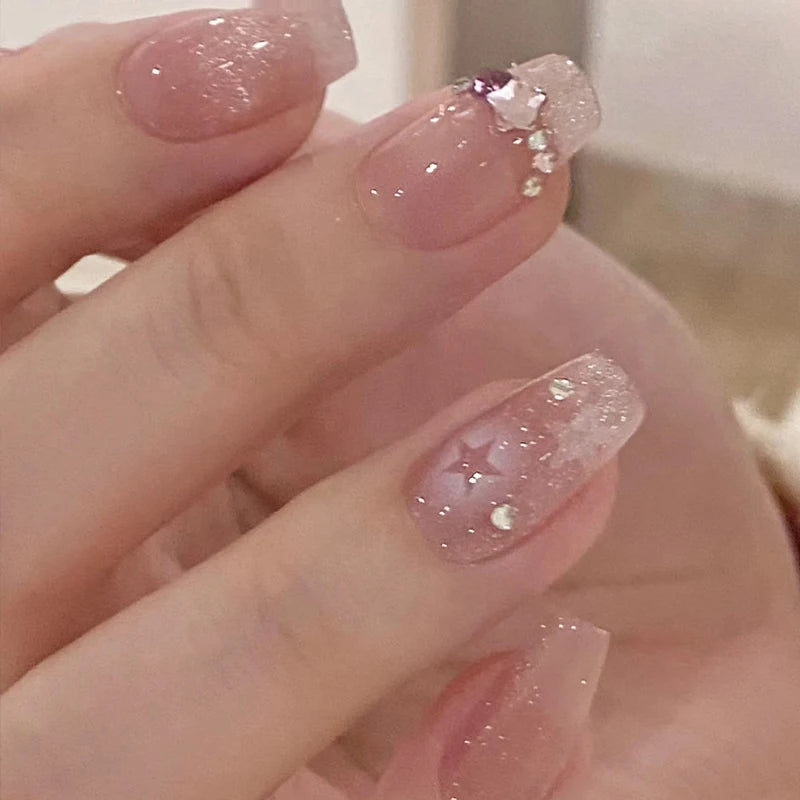 Decorated nail designs shown on hands