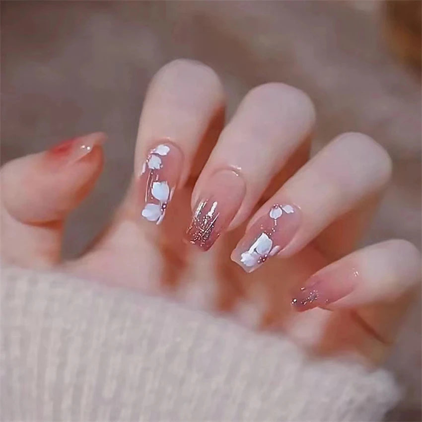 Decorated nail designs shown on hands