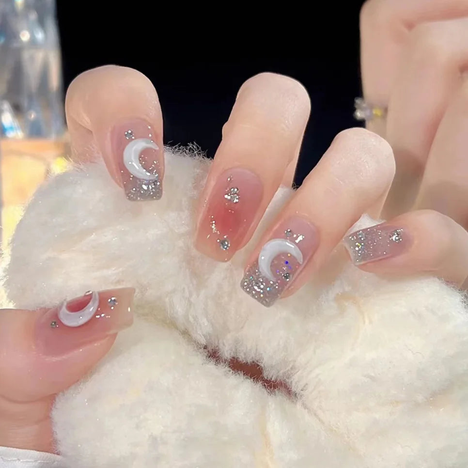 Decorated nail designs shown on hands