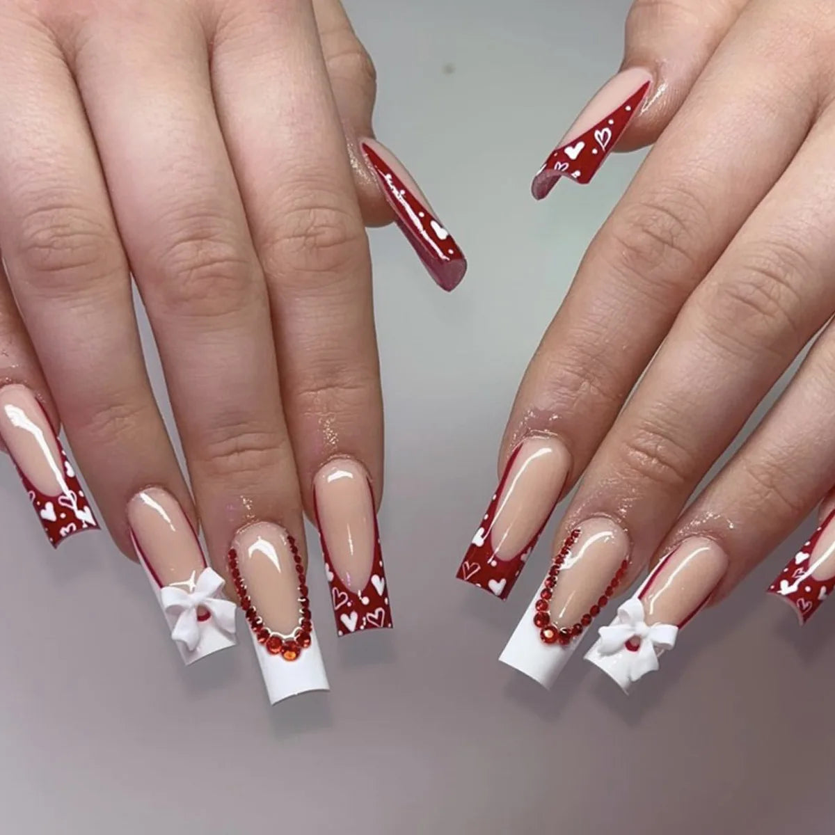 Decorated nail designs shown on hands