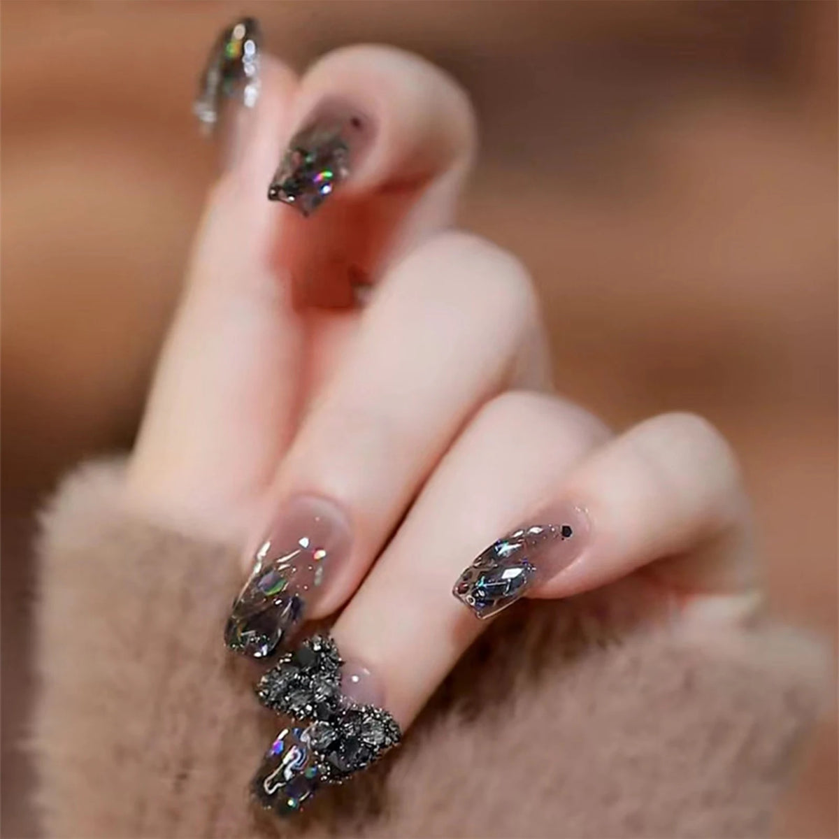 Decorated nails shown on a hand