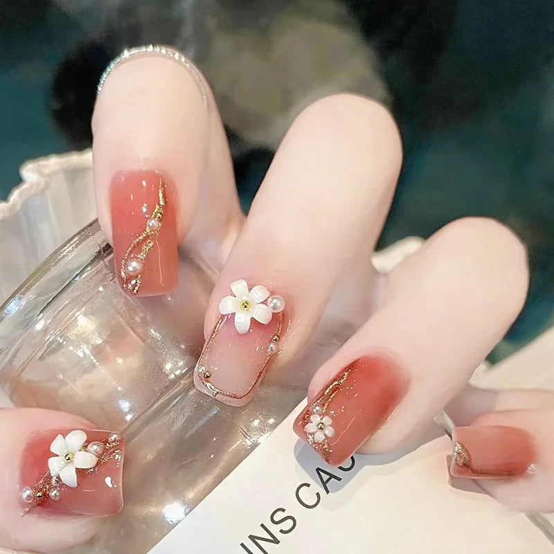 Decorated nail designs shown on hands