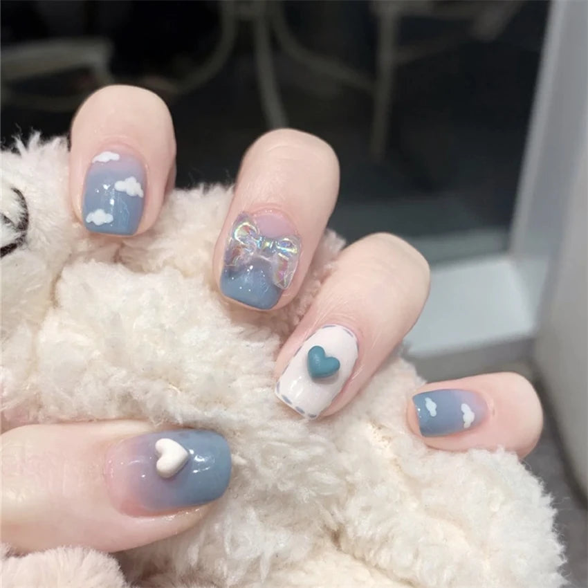 Decorated nail designs shown on hands