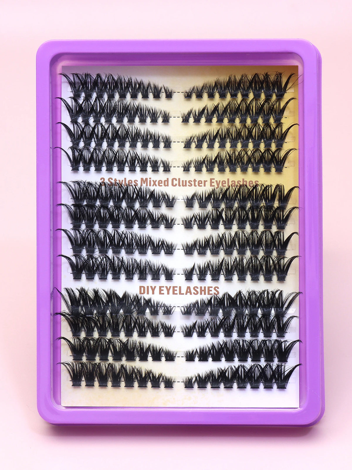 False eyelash clusters arranged in rows in a tray