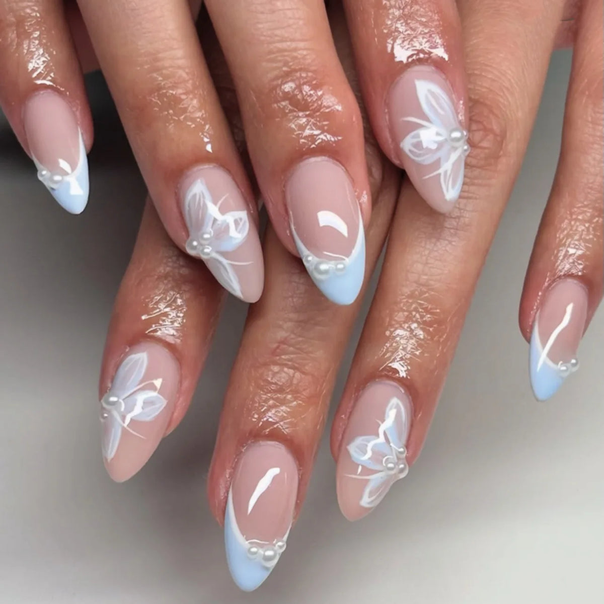 Decorated floral nails shown on hands