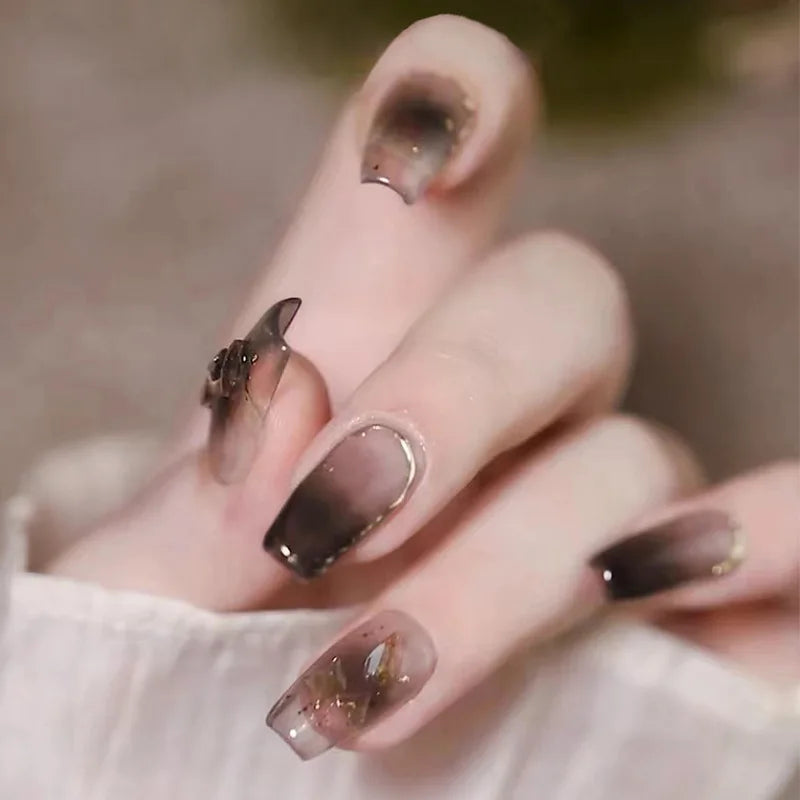 Decorated nail designs shown on hands