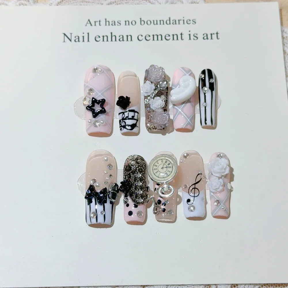 Decorated press-on nail sets with raised embellishments on display cards