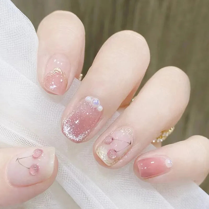 Decorated nail designs shown on hands