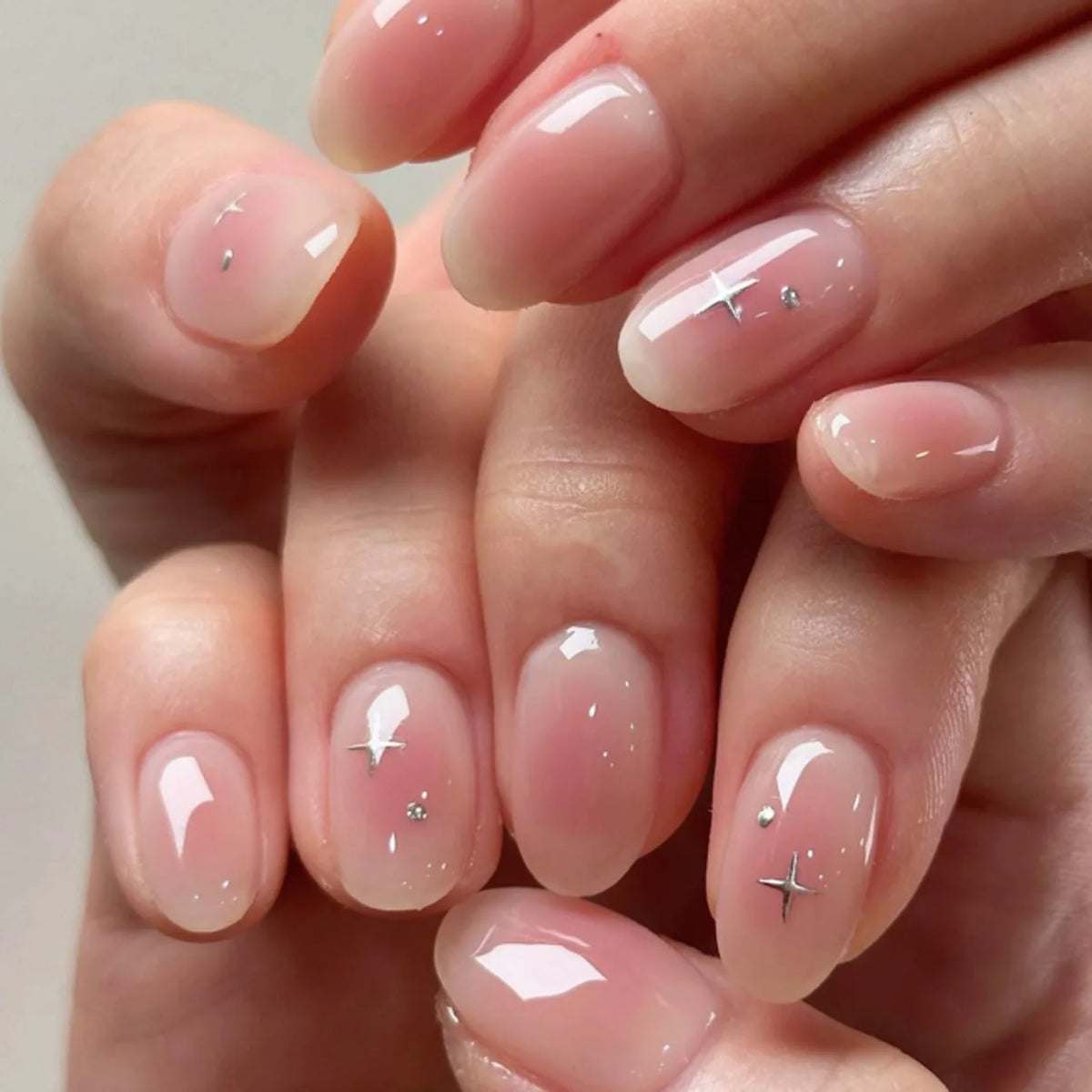 Decorated nail designs shown on hands