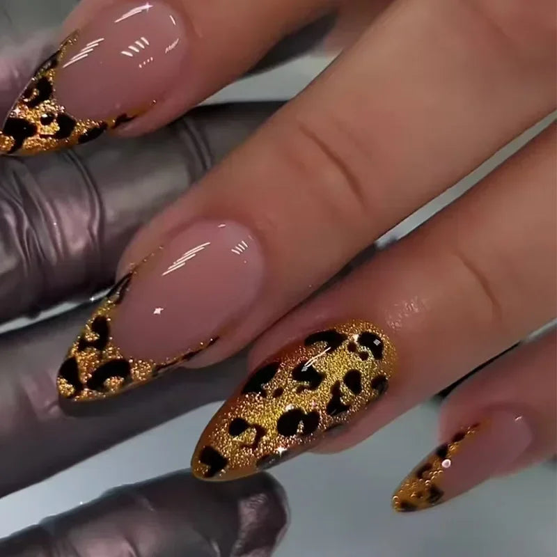 Decorated pointed nails shown on hands